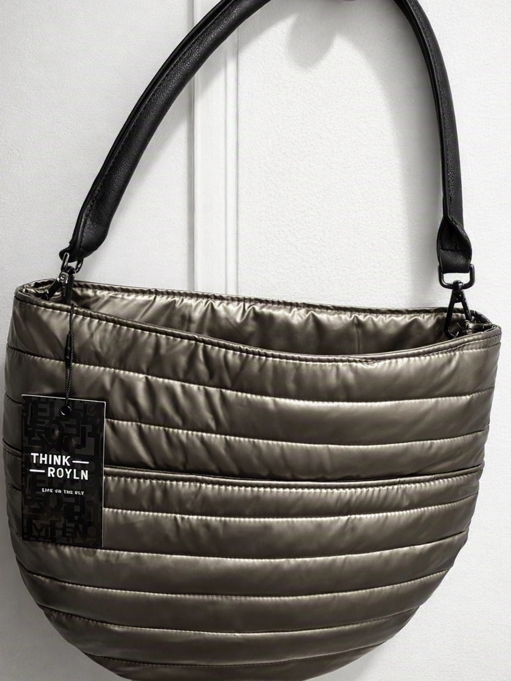 Think Royln metallic silver quilted handbag with horizontal stitching